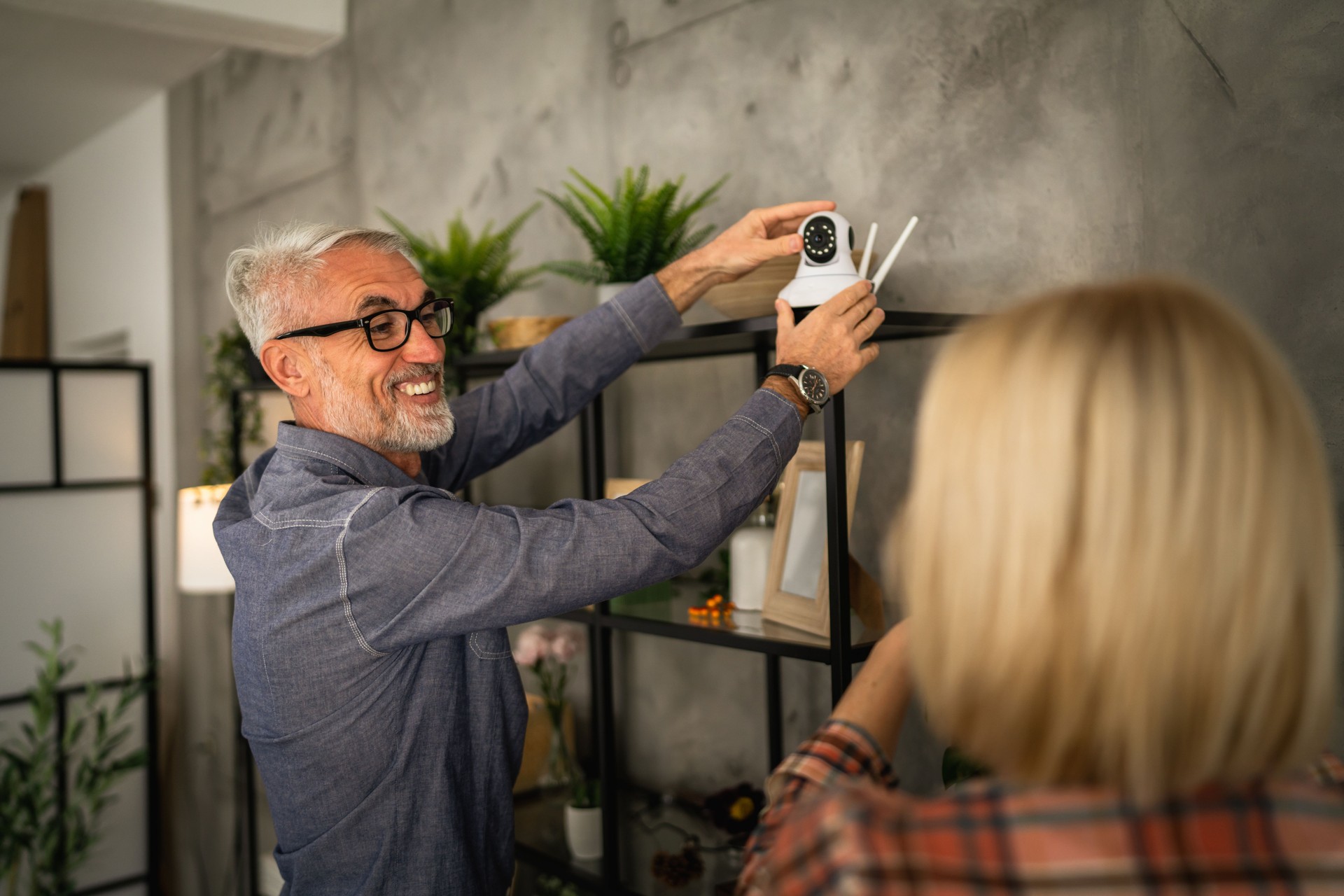 Couple at home connect and install cctv security surveillance camera
